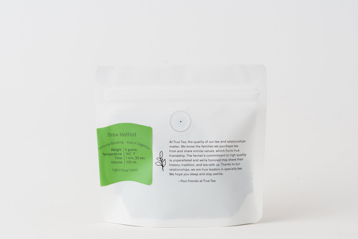 Back of a white package with a bright green label. Package contains loose leaf Organic Gyokuro tea from True Tea, a tea company based in Portland, Oregon