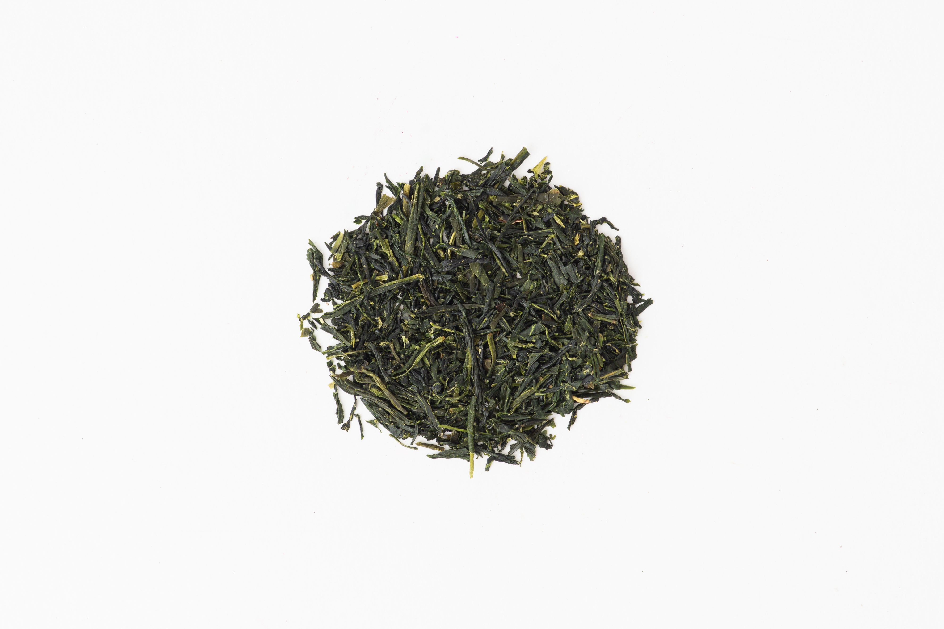 Circle of loose leaf tea. This tea is Organic Gyokuro, a rare green tea from True Tea, a tea company based in Portland, Oregon