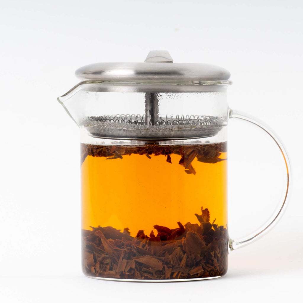 Glass brewer of brewed Organic Earl Grey. This Organic Earl Grey comes from True Tea, a tea company based in Portland, Oregon