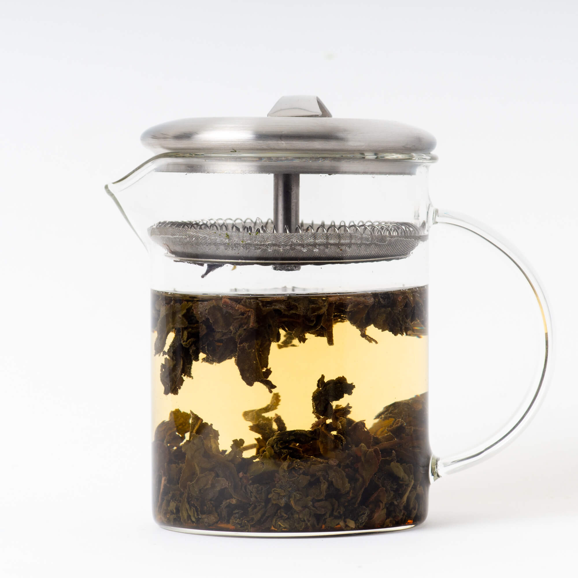Glass brewer with brewed Organic  Dong Ding tea inside. Organic  Dong Ding is a rare loose leaf tea from True Tea, a tea company based in Portland, Oregon
